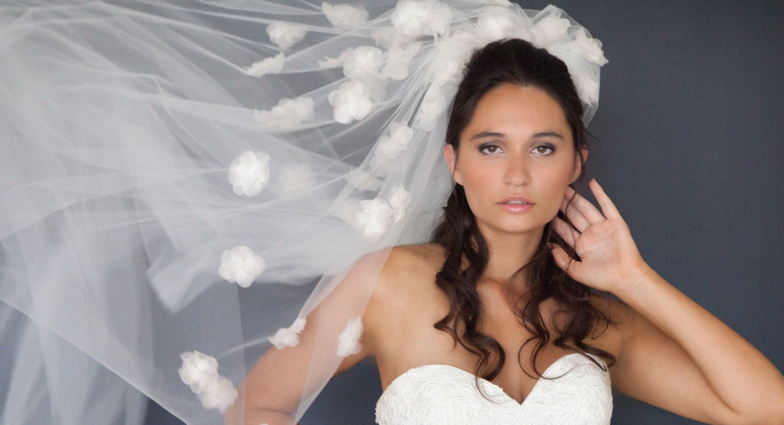 Bride holding a bouquet of white flowers